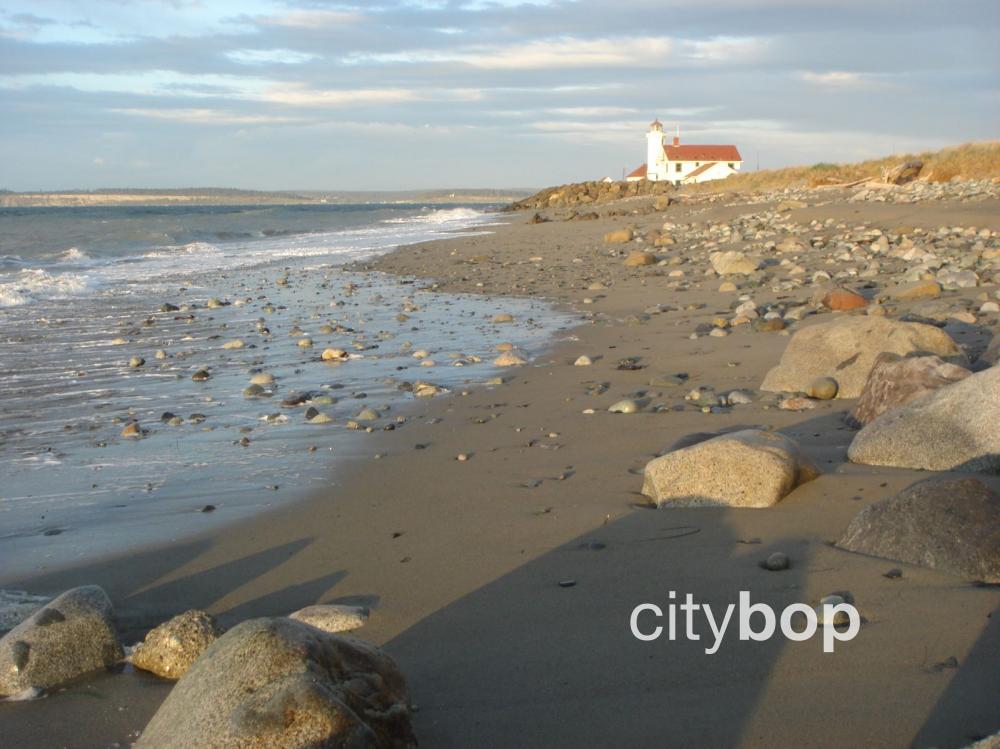 Point Wilson Lighthouse at Fort Worden with beach.